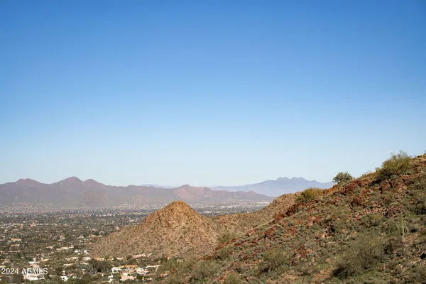 a view of a mountain range in a cloudy sky