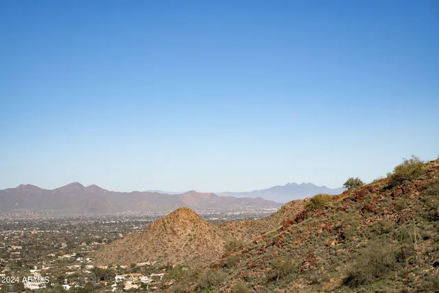 a view of a mountain range in a cloudy sky