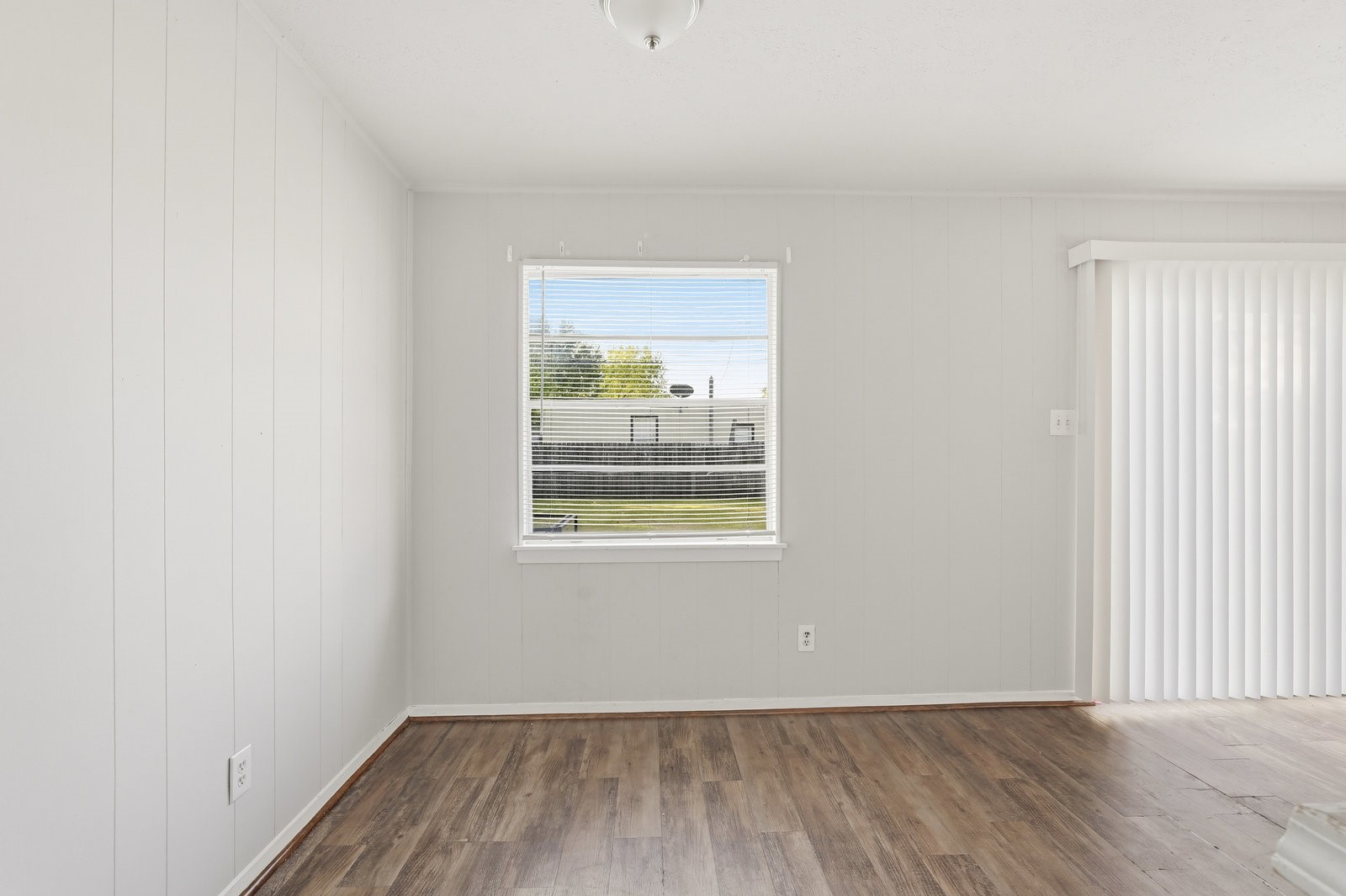 3427 Prudence Drive Houston, TX 77045 - Photo 15 of 25 a view of an empty room with wooden floor and a window