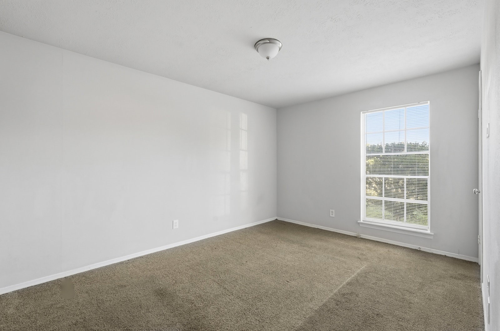 3427 Prudence Drive Houston, TX 77045 - Photo 18 of 25 an empty room with a window