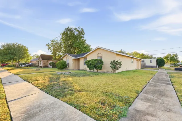 a swimming pool with trees in the background