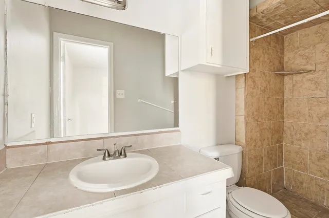 a bathroom with a sink and toilet