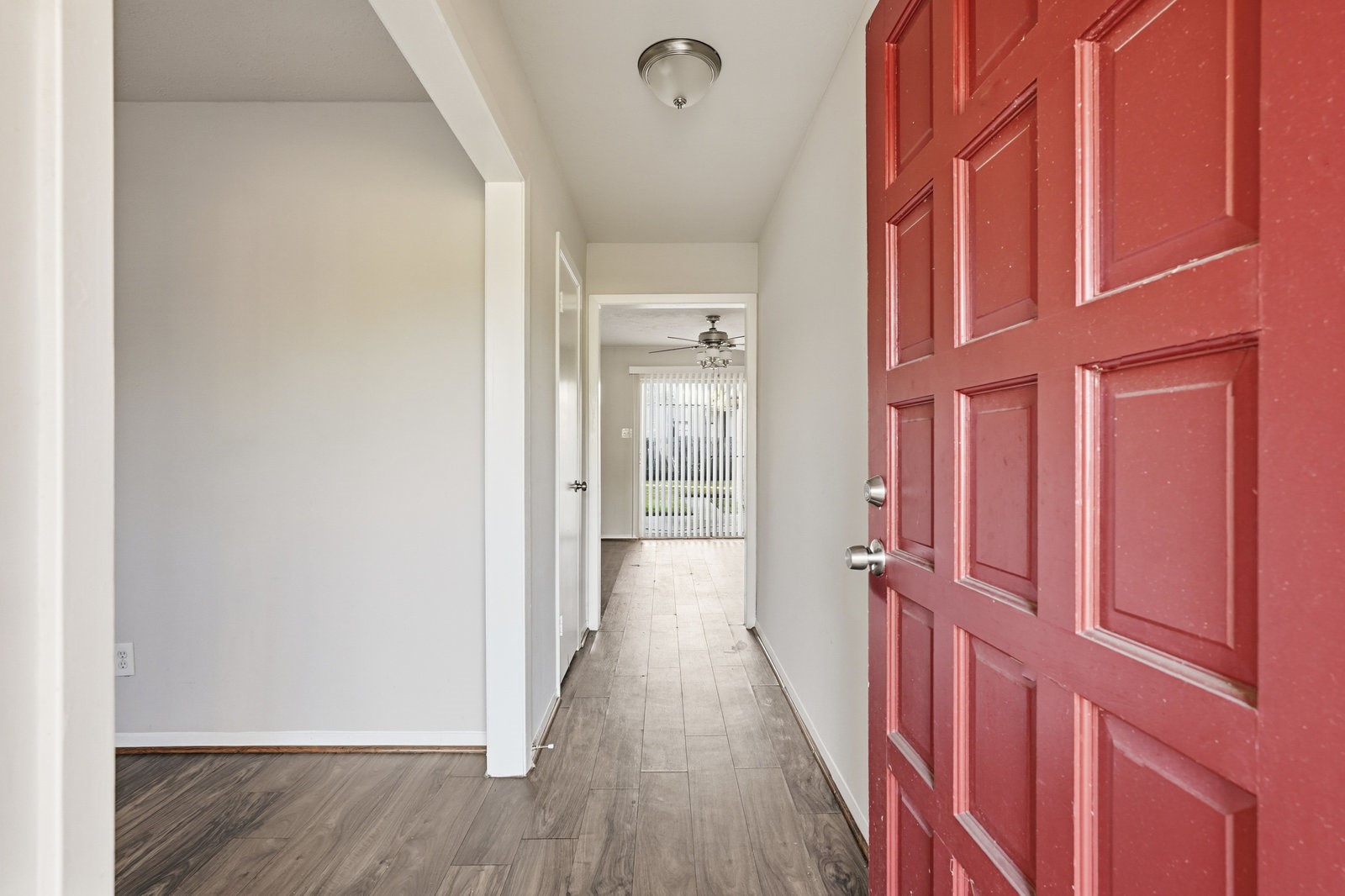 3427 Prudence Drive Houston, TX 77045 - Photo 3 of 25 a view of a hallway with wooden floor and staircase