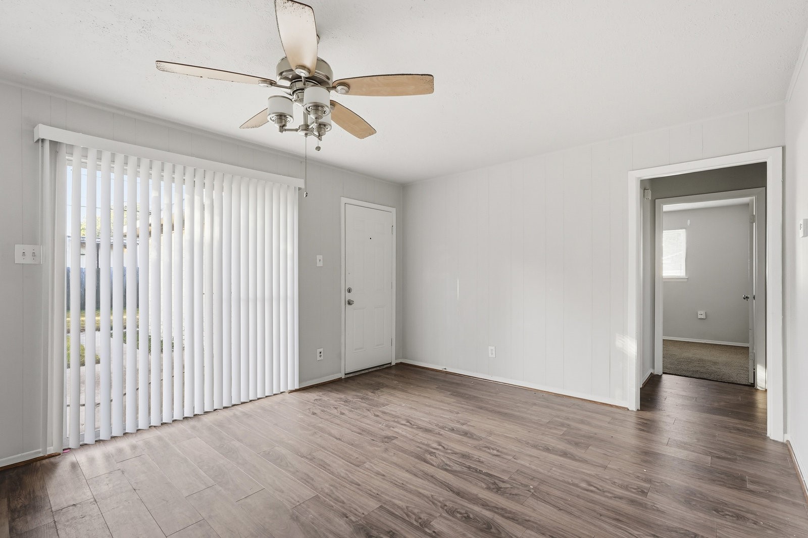 3427 Prudence Drive Houston, TX 77045 - Photo 5 of 25 wooden floor in an empty room with a window