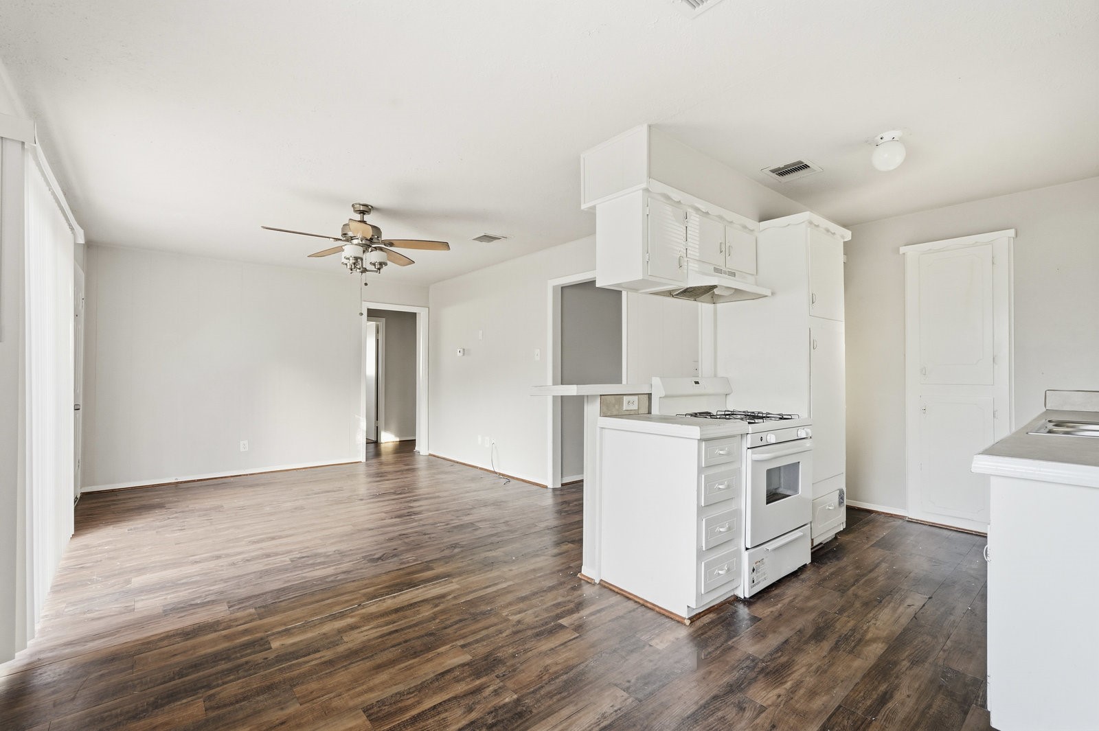 3427 Prudence Drive Houston, TX 77045 - Photo 7 of 25 a kitchen with stainless steel appliances a stove top oven and cabinets