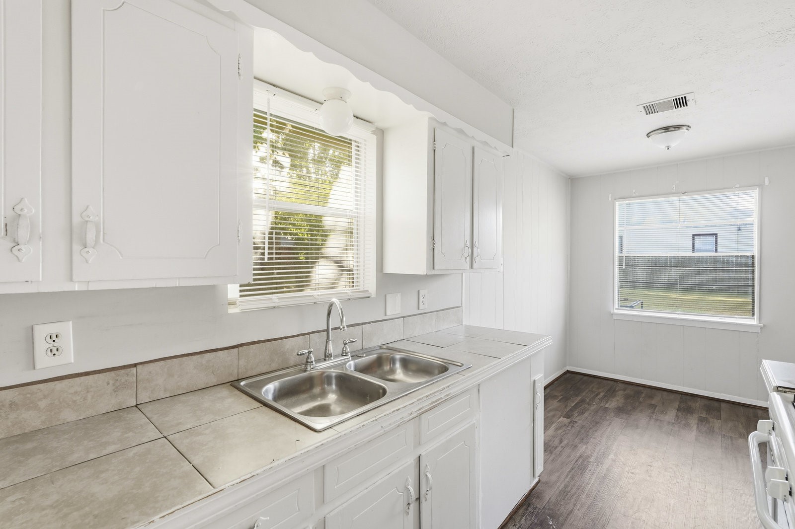 3427 Prudence Drive Houston, TX 77045 - Photo 10 of 25 a kitchen with a sink cabinets and window