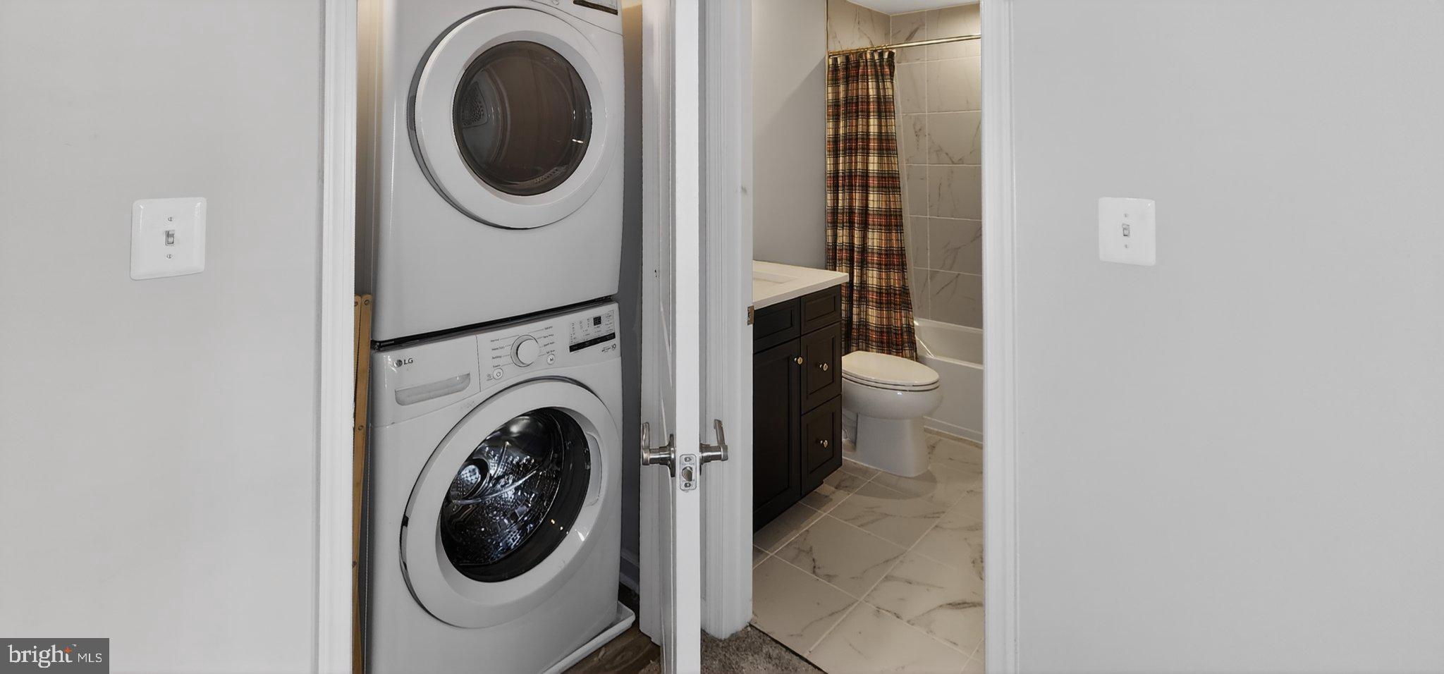 10570 Sally Ride Lane Lanham, MD 20706 - Photo 19 of 32 a utility room with dryer and washer