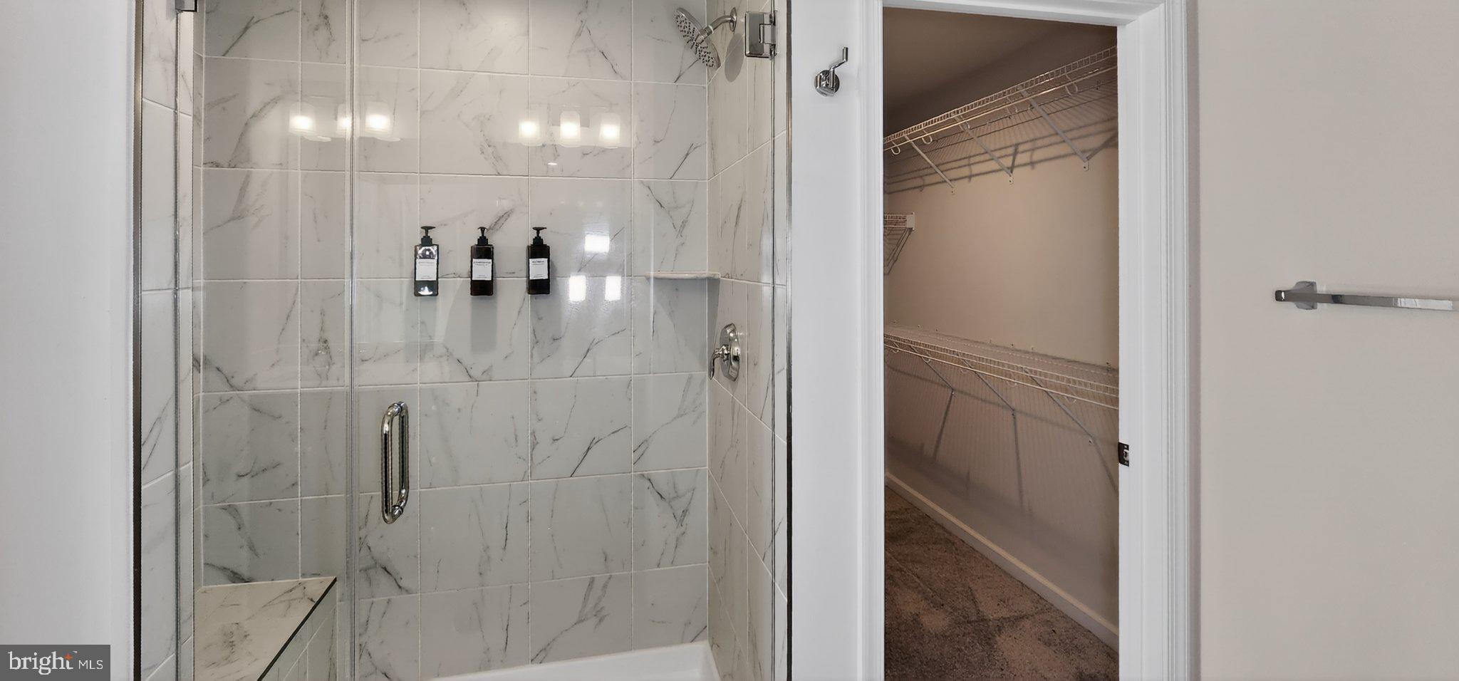 10570 Sally Ride Lane Lanham, MD 20706 - Photo 21 of 32 a bathroom with a glass shower door