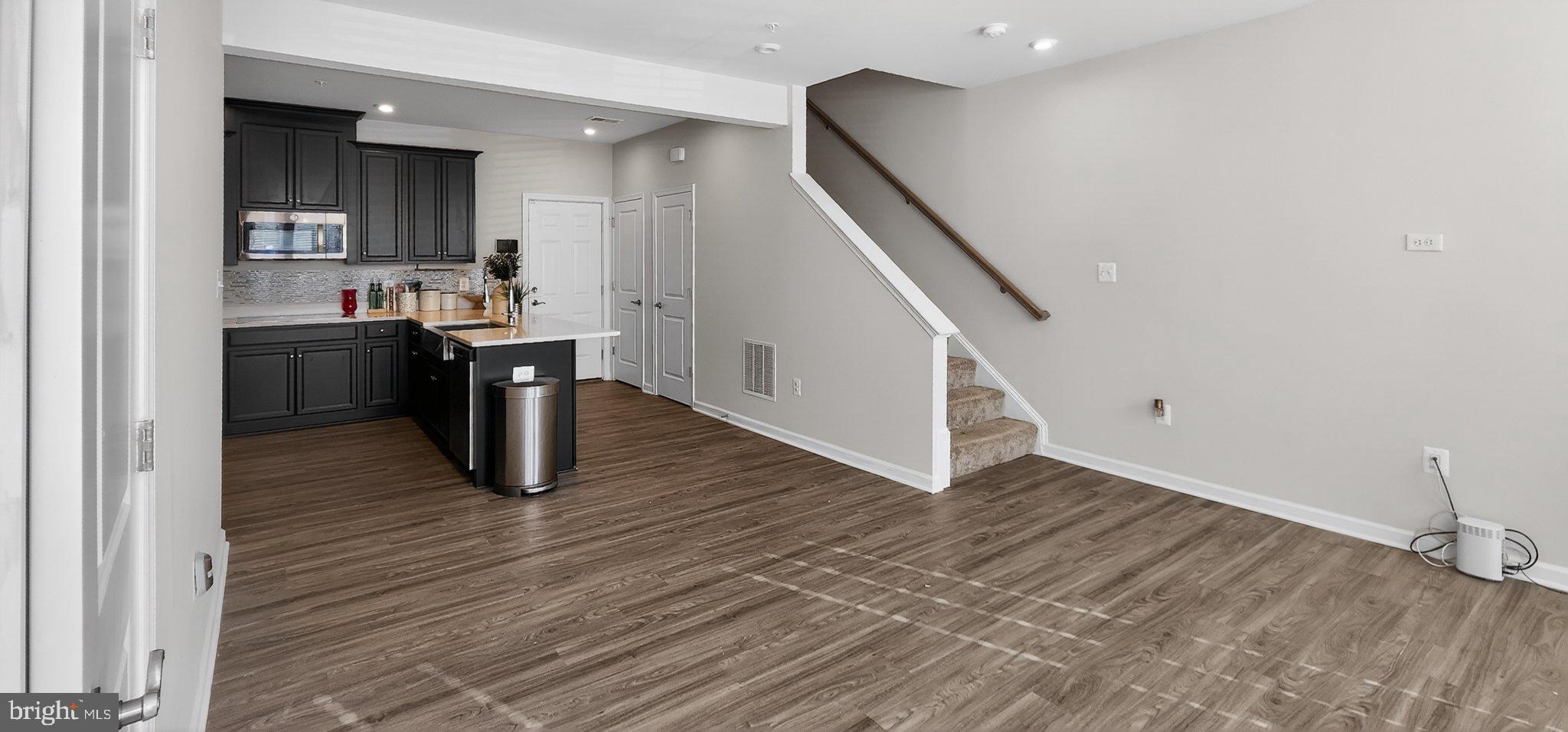 10570 Sally Ride Lane Lanham, MD 20706 - Photo 5 of 32 a view of kitchen and wooden floor