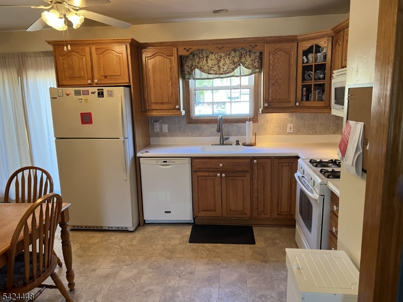 20 Nottingham Drive Howell, NJ 07731 - Photo 9 of 21 a kitchen with stainless steel appliances granite countertop a refrigerator a sink a stove and a refrigerator