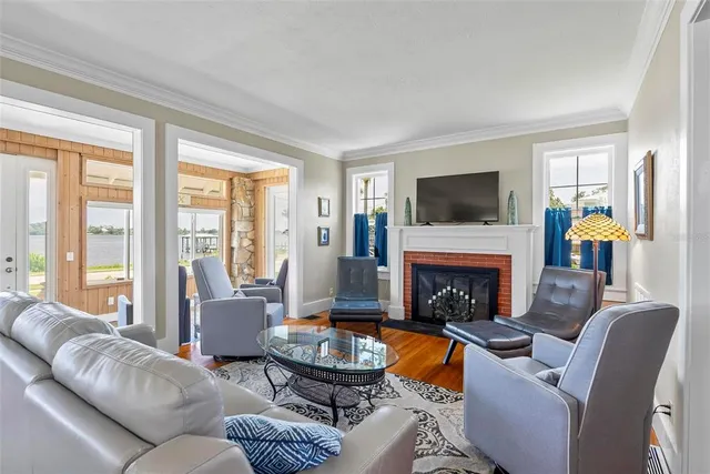 a living room with furniture a rug and a window