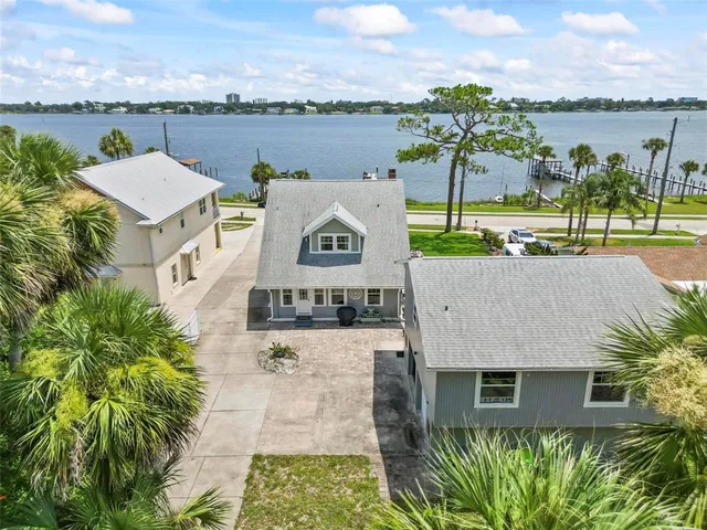 a large kitchen with stainless steel appliances granite countertop a lot of counter space and wooden floors