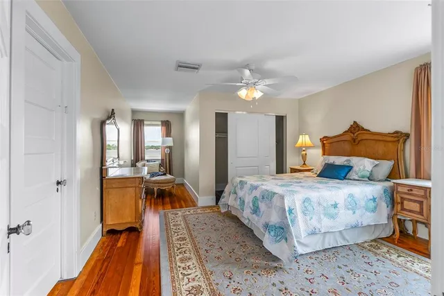a bathroom with a sink a toilet and a window