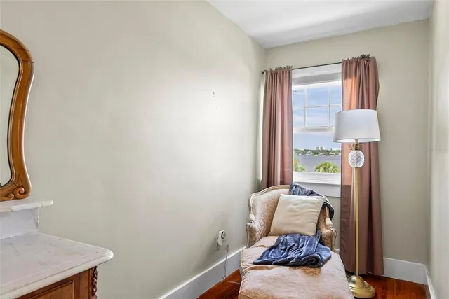 a bathroom with a sink a light fixture and a mirror