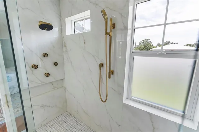 an aerial view of a houses with a lake view