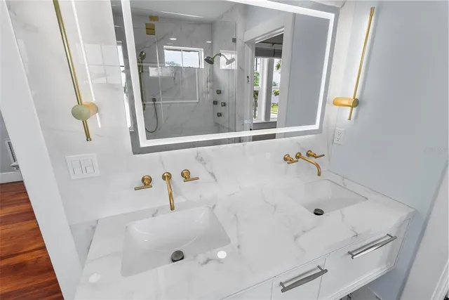 an aerial view of residential houses with city view