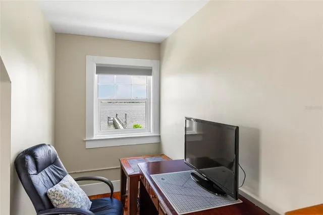 a view of a lake with a house swimming pool and outdoor space