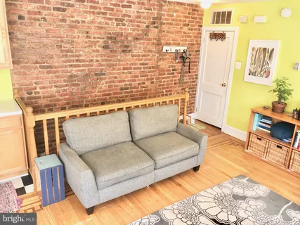 a living room with furniture and a rug