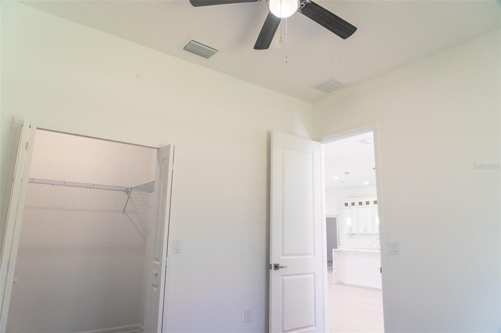17820 Southwest 33rd Terrace Ocala, FL 34473 - Photo 13 of 35 a bathroom with a shower and a ceiling fan