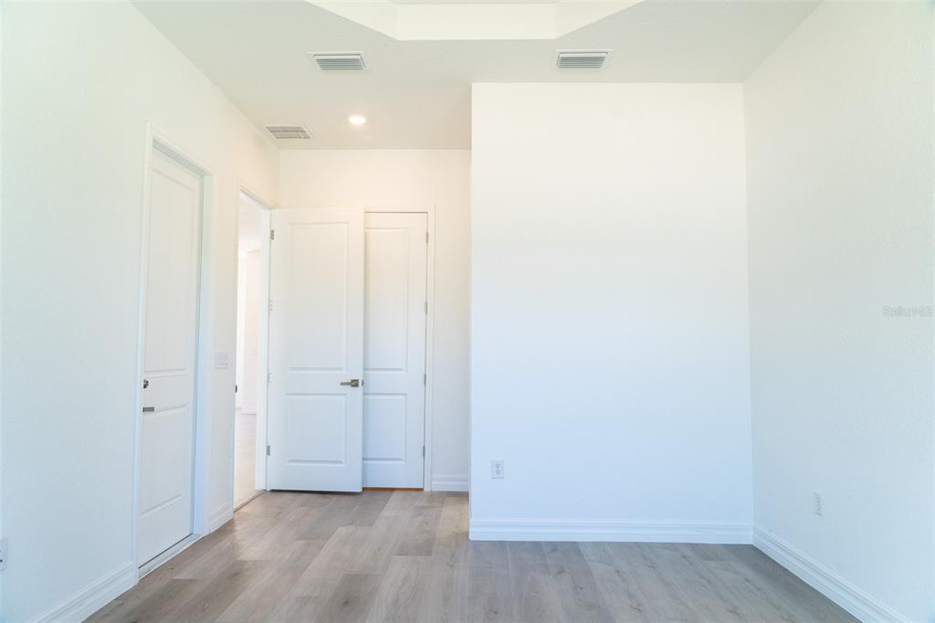17820 Southwest 33rd Terrace Ocala, FL 34473 - Photo 16 of 35 a view of a hallway with wooden floor