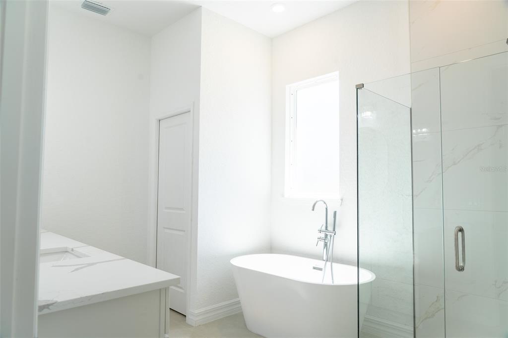 17820 Southwest 33rd Terrace Ocala, FL 34473 - Photo 17 of 35 a bathroom with a white sink and a mirror