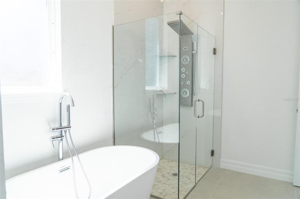 17820 Southwest 33rd Terrace Ocala, FL 34473 - Photo 19 of 35 a bathroom with a bathtub and shower