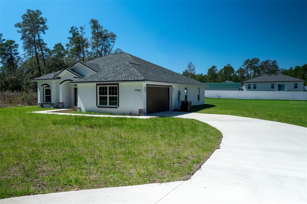 17820 Southwest 33rd Terrace Ocala, FL 34473 - Photo 2 of 35 a front view of a house with garden