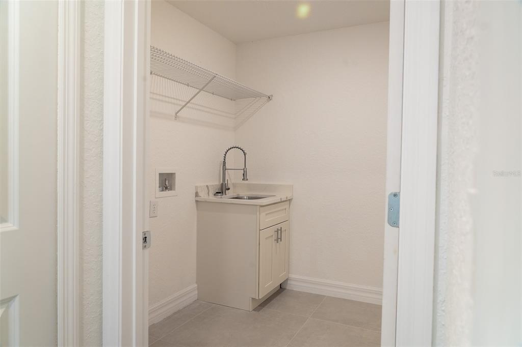 17820 Southwest 33rd Terrace Ocala, FL 34473 - Photo 22 of 35 a room with a sink and mirror