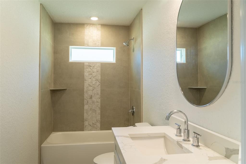 17820 Southwest 33rd Terrace Ocala, FL 34473 - Photo 28 of 35 a bathroom with a sink a toilet and shower