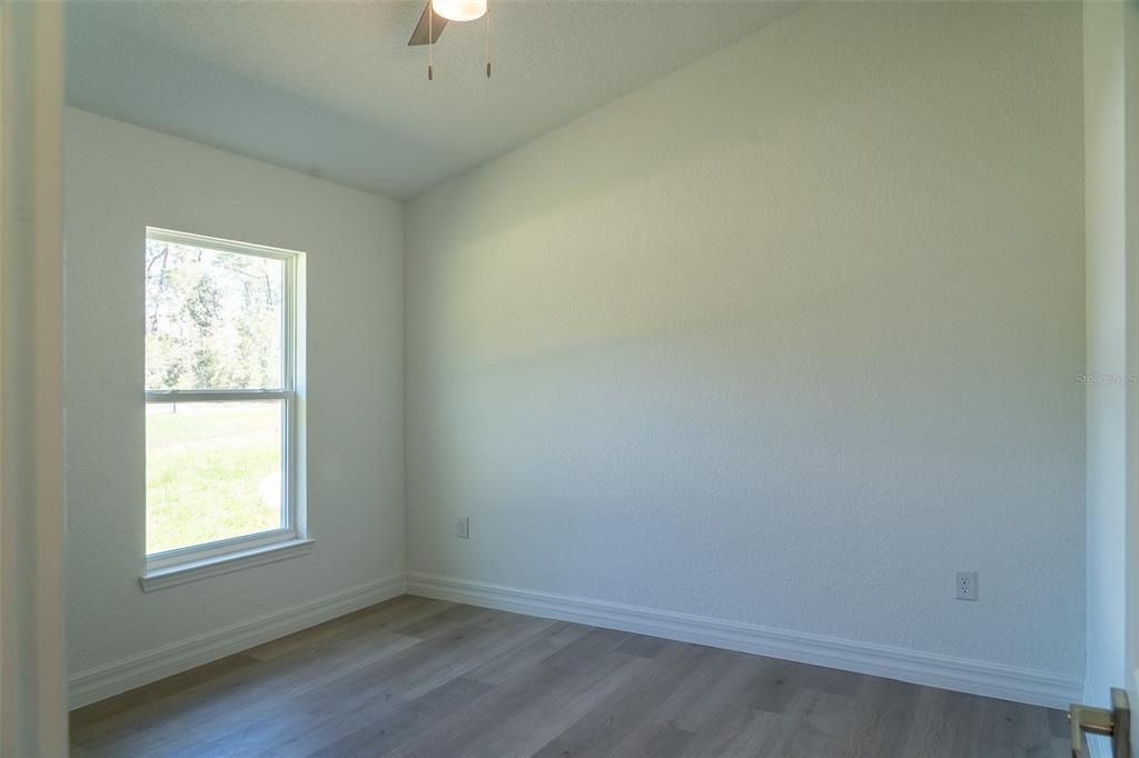 17820 Southwest 33rd Terrace Ocala, FL 34473 - Photo 30 of 35 an empty room with a window
