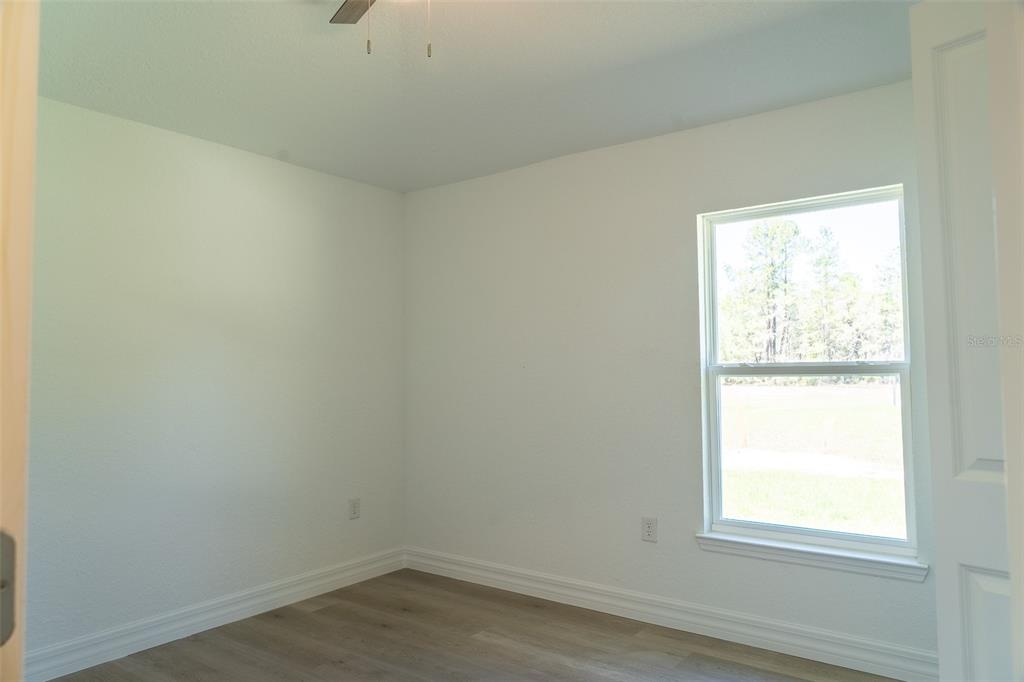 17820 Southwest 33rd Terrace Ocala, FL 34473 - Photo 32 of 35 an empty room with a window