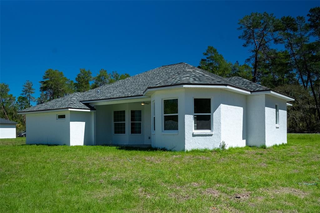 17820 Southwest 33rd Terrace Ocala, FL 34473 - Photo 4 of 35 front view of a house with a garden