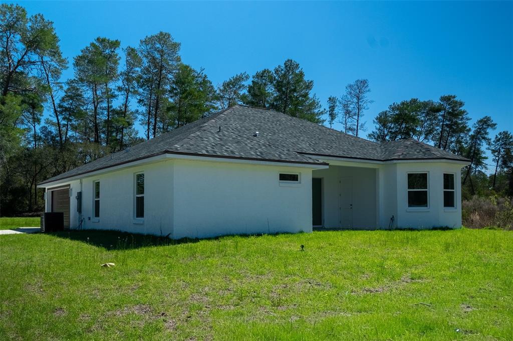 17820 Southwest 33rd Terrace Ocala, FL 34473 - Photo 6 of 35 a view of a backyard with a garden