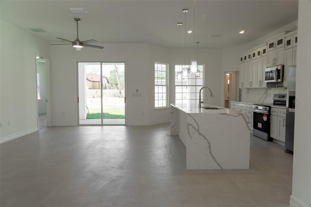 17820 Southwest 33rd Terrace Ocala, FL 34473 - Photo 8 of 35 a large living room with a large window