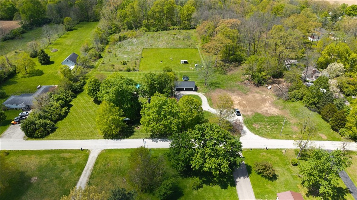 5120 Wheelock Road Troy, OH 45373 - Photo 64 of 67 An aerial view showcases an expansive property with lush green landscapes and diverse foliage.
