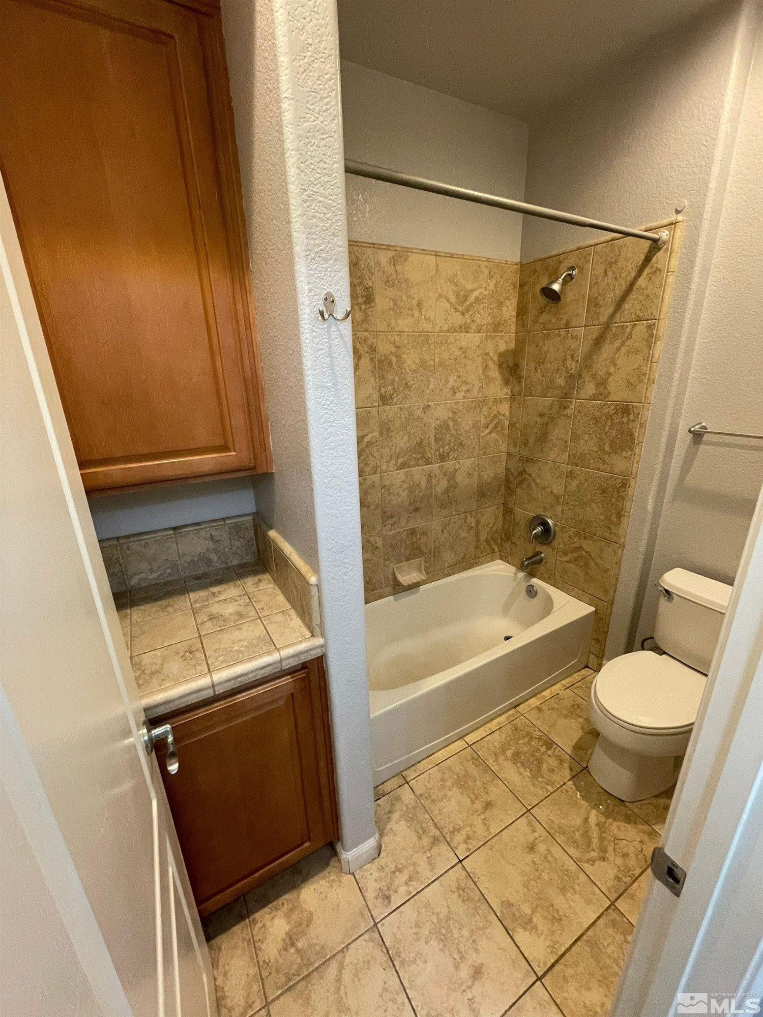 3660 Sienna Pointe Court Reno, NV 89512 - Photo 14 of 24 a bathroom with a granite countertop sink toilet and shower