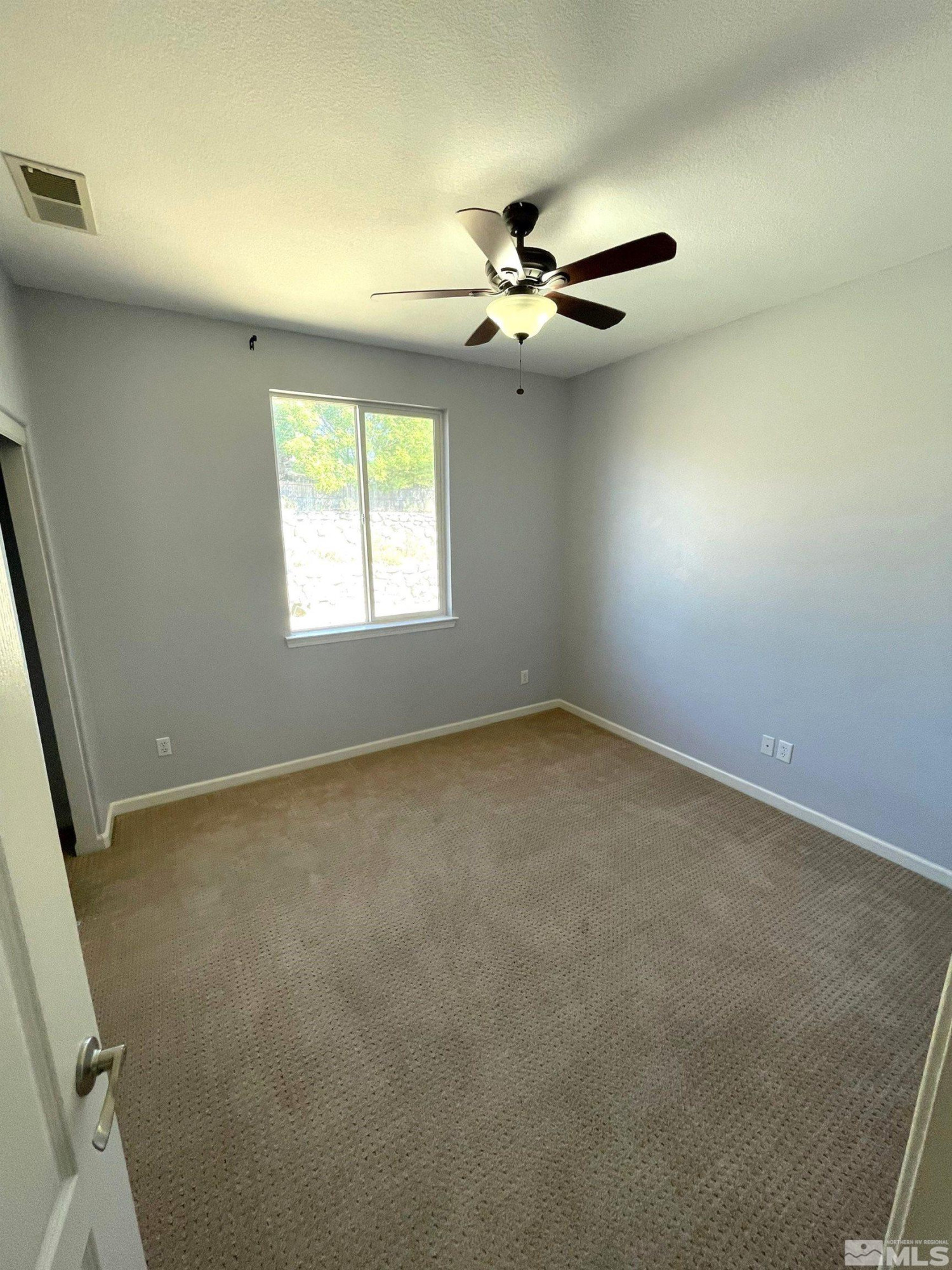 3660 Sienna Pointe Court Reno, NV 89512 - Photo 20 of 24 an empty room with windows and fan