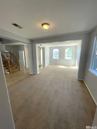 a view of a livingroom with a staircase