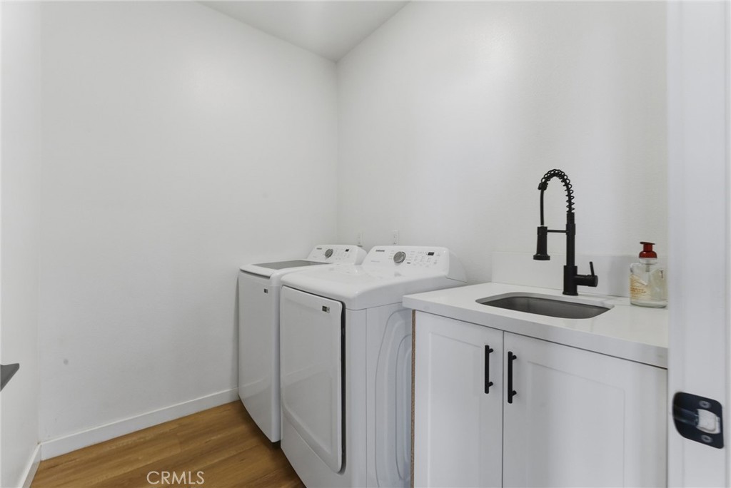 10710 Brookfield Drive Riverside, CA 92505 - Photo 13 of 32 a bathroom with a sink and a mirror
