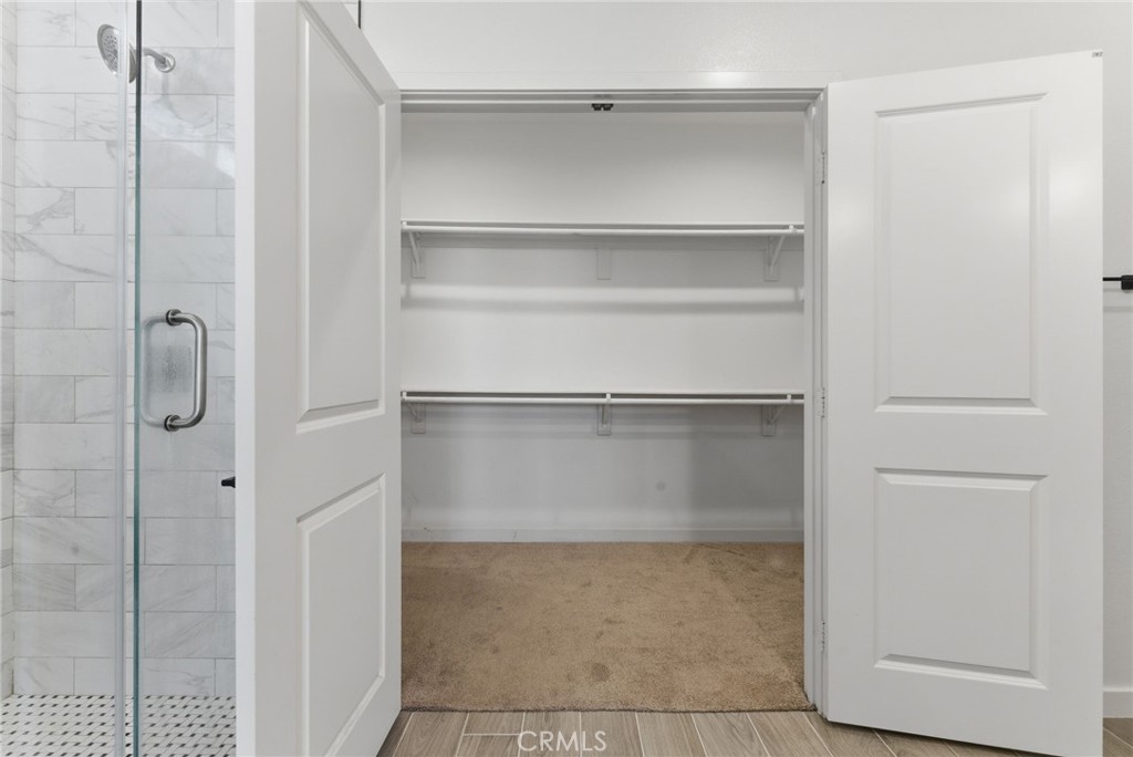 10710 Brookfield Drive Riverside, CA 92505 - Photo 16 of 32 a bathroom with a glass shower door