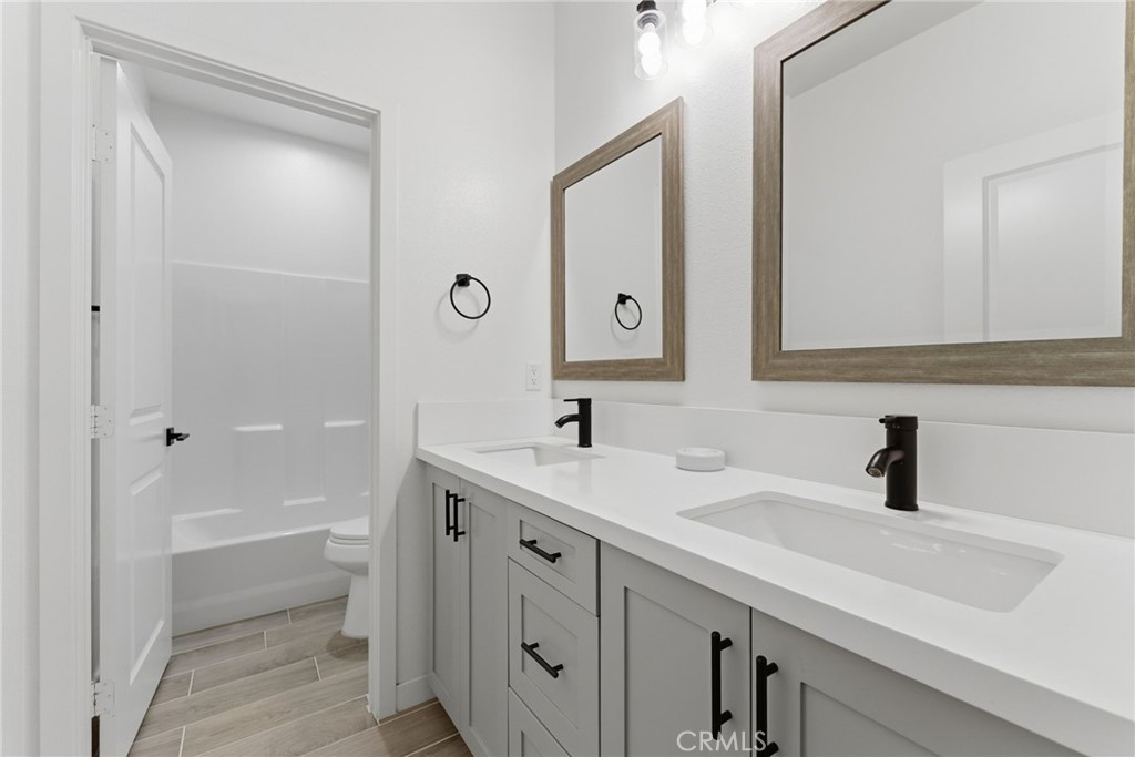 10710 Brookfield Drive Riverside, CA 92505 - Photo 20 of 32 a bathroom with a sink and a mirror