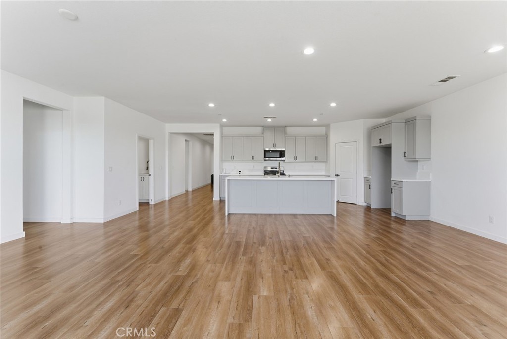 10710 Brookfield Drive Riverside, CA 92505 - Photo 5 of 32 a view of kitchen with wooden floor and window