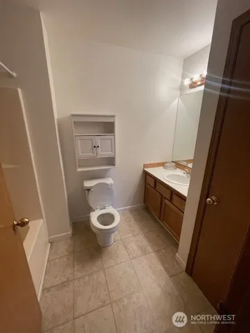 a bathroom with a toilet and a sink