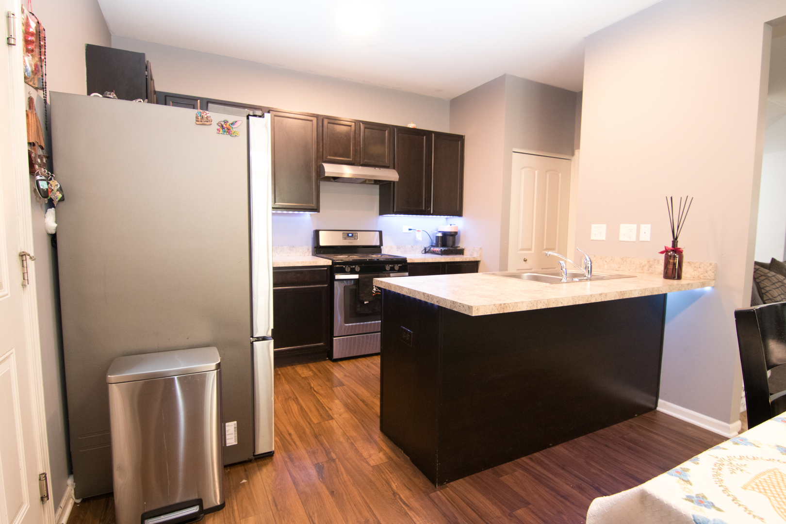 3619 Daisy Lane Elgin, IL 60124 - Photo 11 of 28 a kitchen with a sink a refrigerator a stove a microwave and wooden floor
