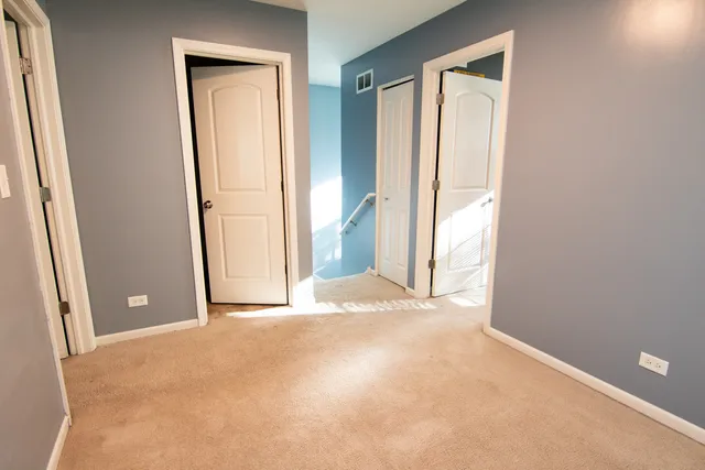 a bedroom with a bed and a closet