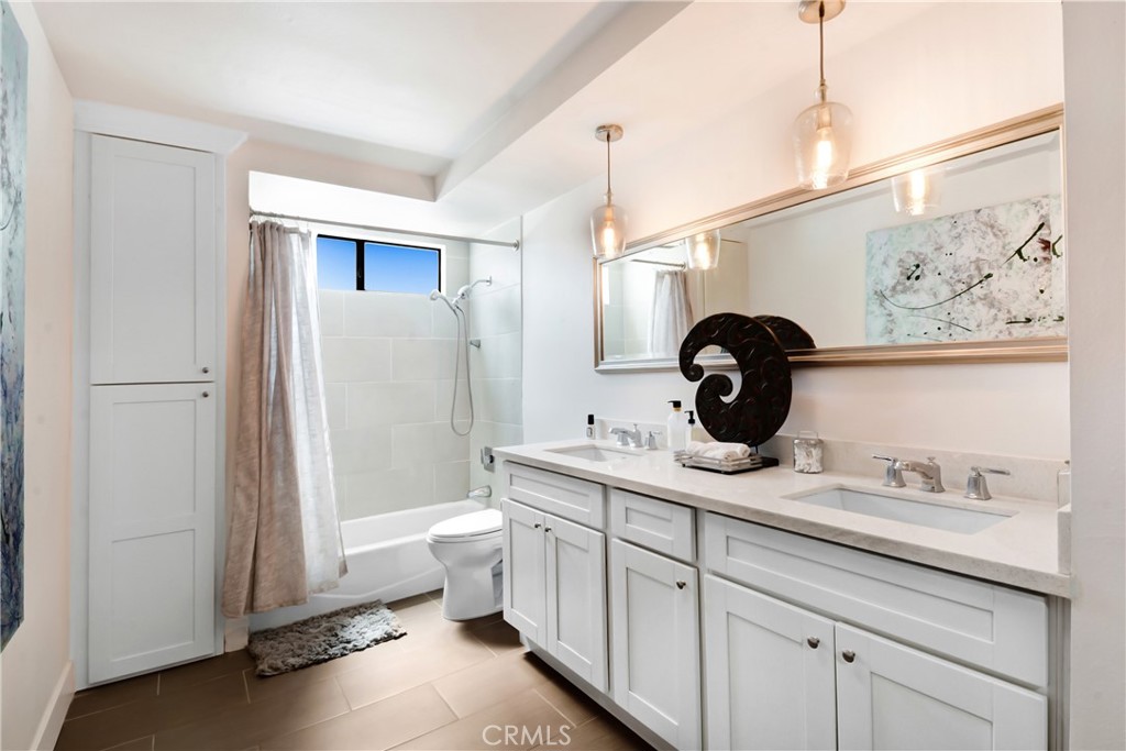 17295 Ridge Canyon Drive Riverside, CA 92506 - Photo 26 of 53 a bathroom with a toilet sink and mirror