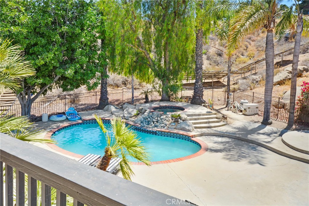 17295 Ridge Canyon Drive Riverside, CA 92506 - Photo 35 of 53 a view of a swimming pool with lounge chair