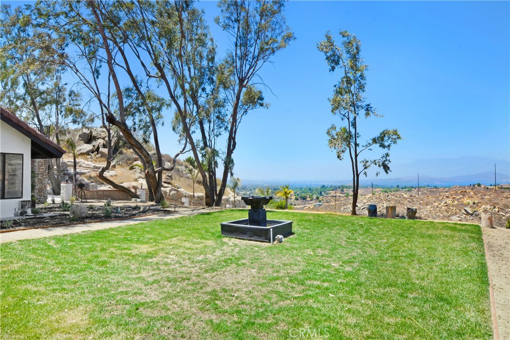 17295 Ridge Canyon Drive Riverside, CA 92506 - Photo 7 of 53 a swimming pool with outdoor seating and garden