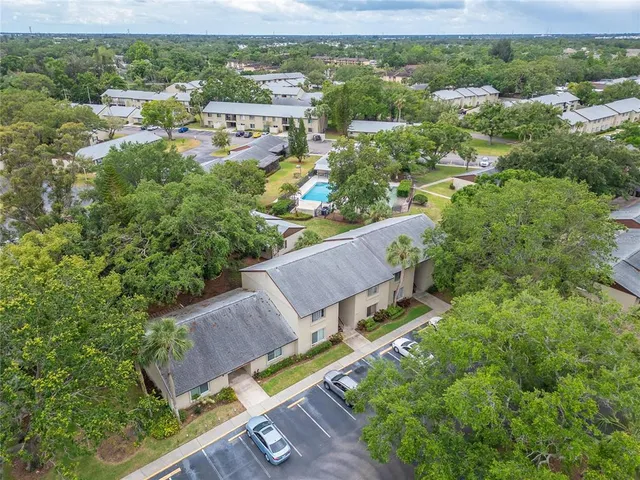 an aerial view of a house with a garden