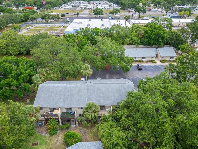 an aerial view of a house with swimming pool and outdoor space